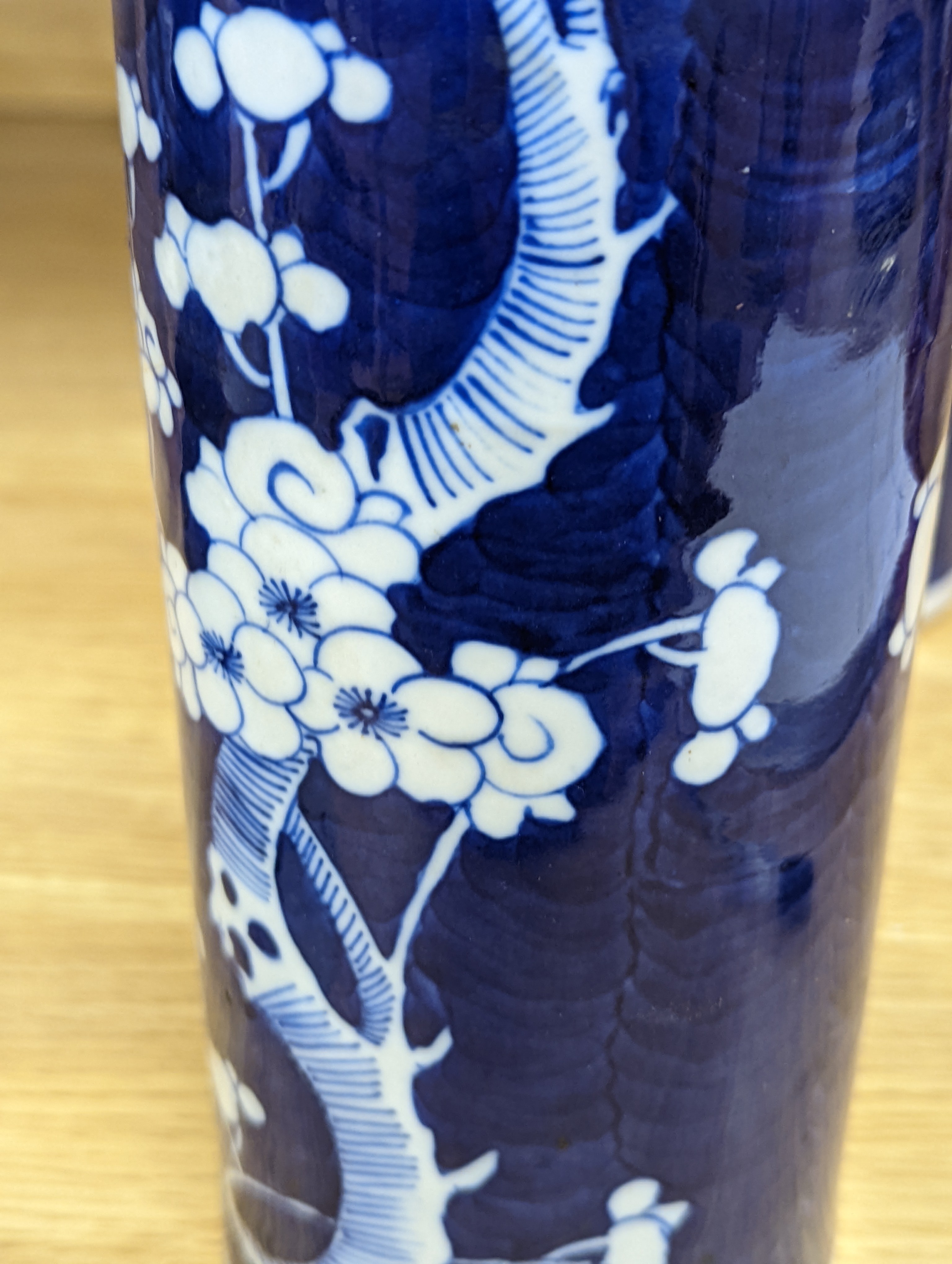 An 18th century Chinese famille rose mug, a Chinese Imari tea caddy and two Chinese blue and white sleeve vases 30cm (4)